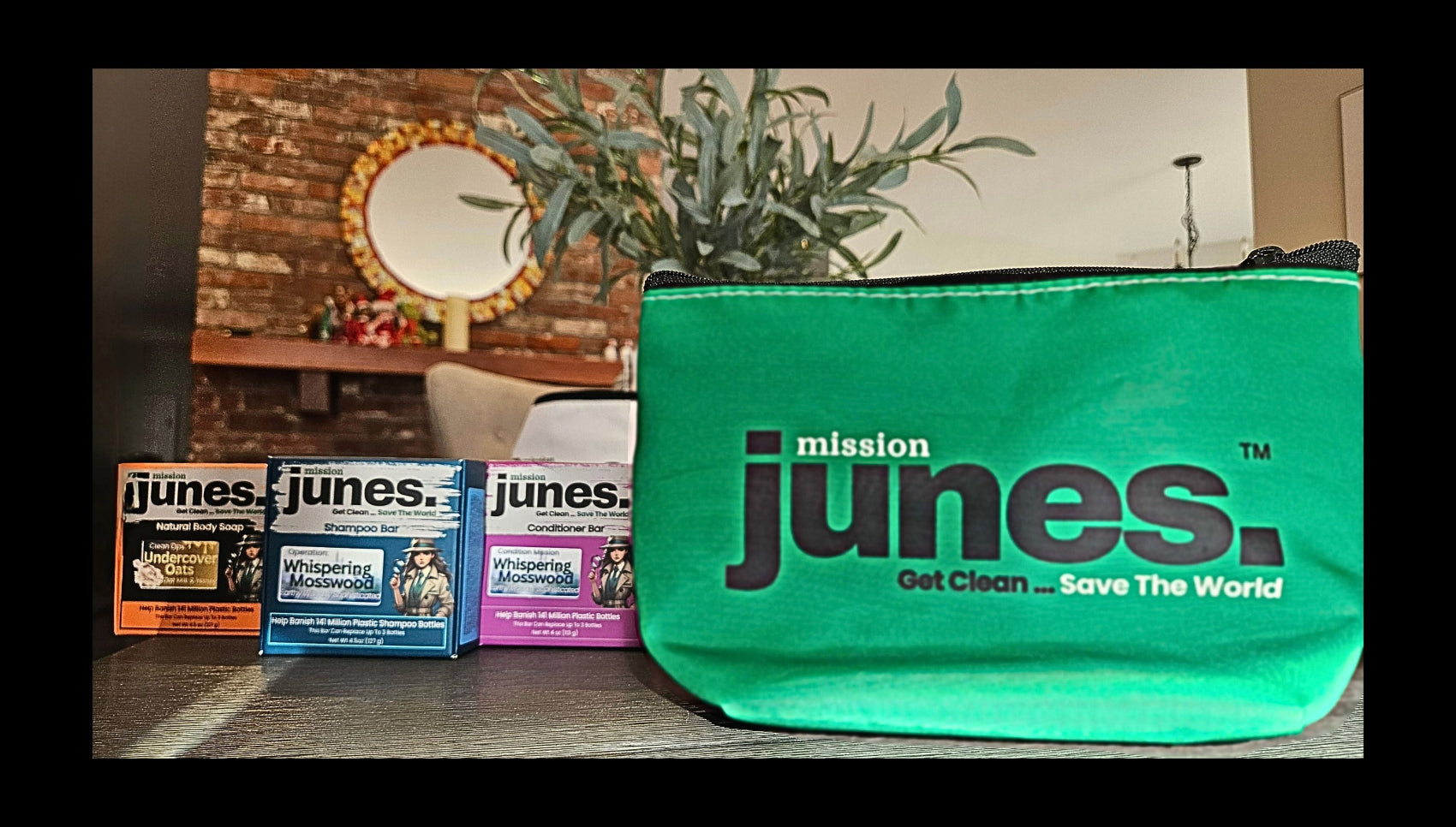 Mission Junes Travel Bag in green made from recycled sails by Sea Bags, shown with shampoo, conditioner, and body soap bars
